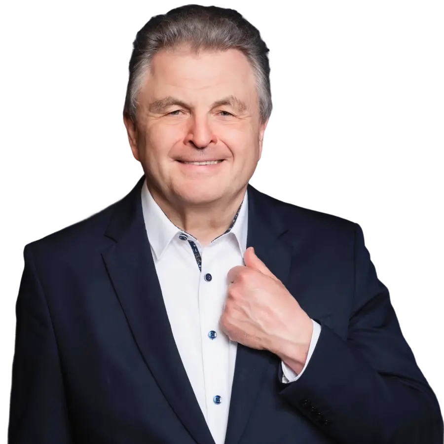Smiling man in a suit with hand gesture